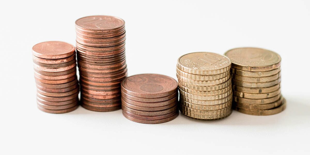 stacks of coins, how much do staffing agencies charge