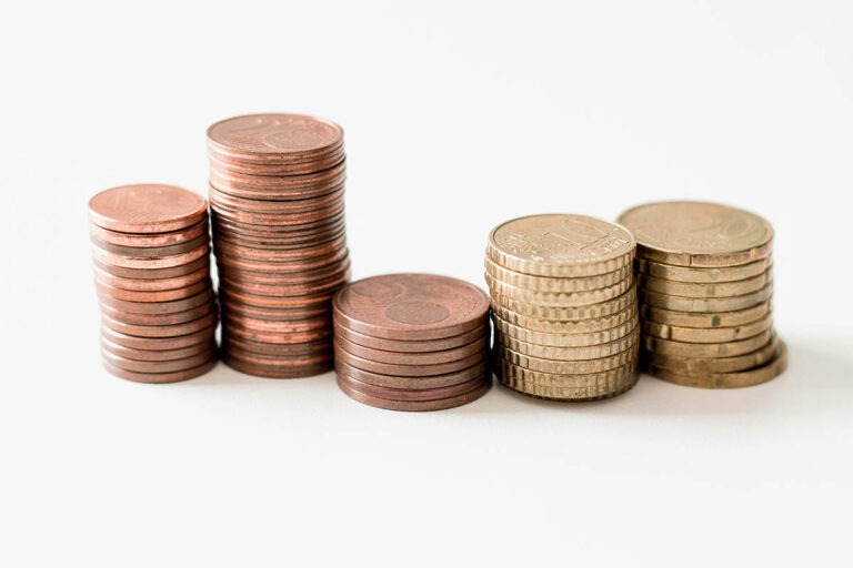 stacks of coins, how much do staffing agencies charge